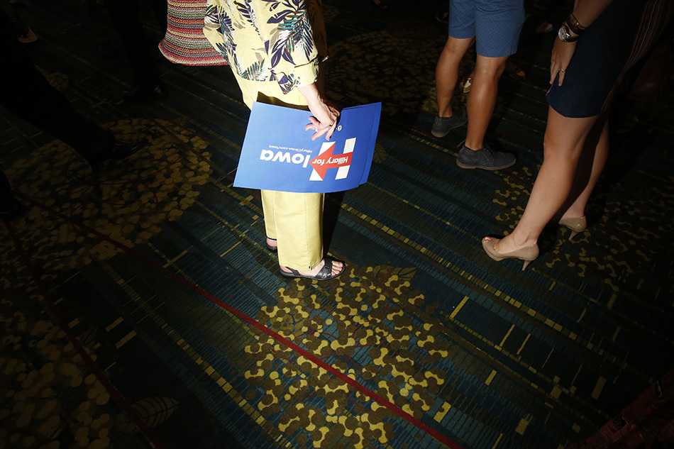 An attendee to the 2015 Iowa Democratic Party Hall of Fame Celebration holds a Hillary Clinton sign at the Cedar Rapids Convention Center in Cedar Rapids on Friday, July 17, 2015. (Adam Wesley/The Gazette)