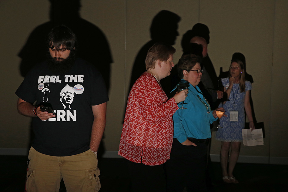 Attendees to the 2015 Iowa Democratic Party Hall of Fame Celebration mill around waiting for the program to begin at the Cedar Rapids Convention Center in Cedar Rapids on Friday, July 17, 2015. (Adam Wesley/The Gazette)