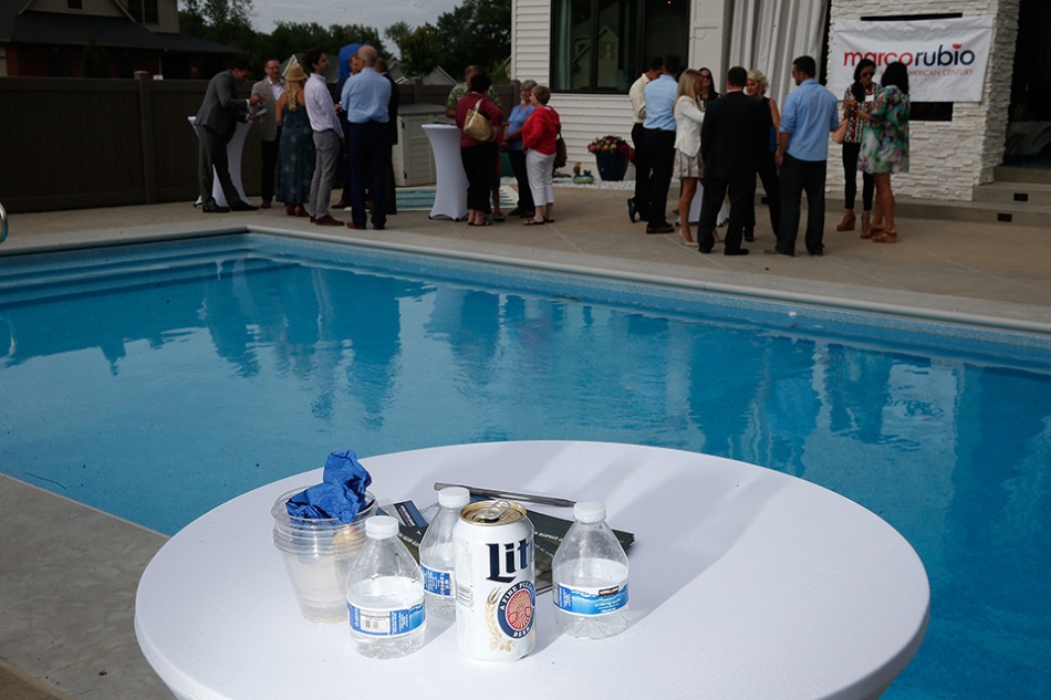 Empty water and beer containers sit on a table after Republican presidential candidate Sen. Marco Rubio (R-FL) spoke at a poolside happy hour in Coralville on Wednesday, July 8, 2015. (Adam Wesley/The Gazette)