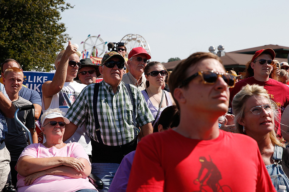 The audience listens as GOP presidential candidate Mike Huckabee speaks on the Des Moines Register Soapbox at the 2015 Iowa State Fair in Des Moines on Thursday, Aug. 13, 2015. (Adam Wesley/The Gazette)