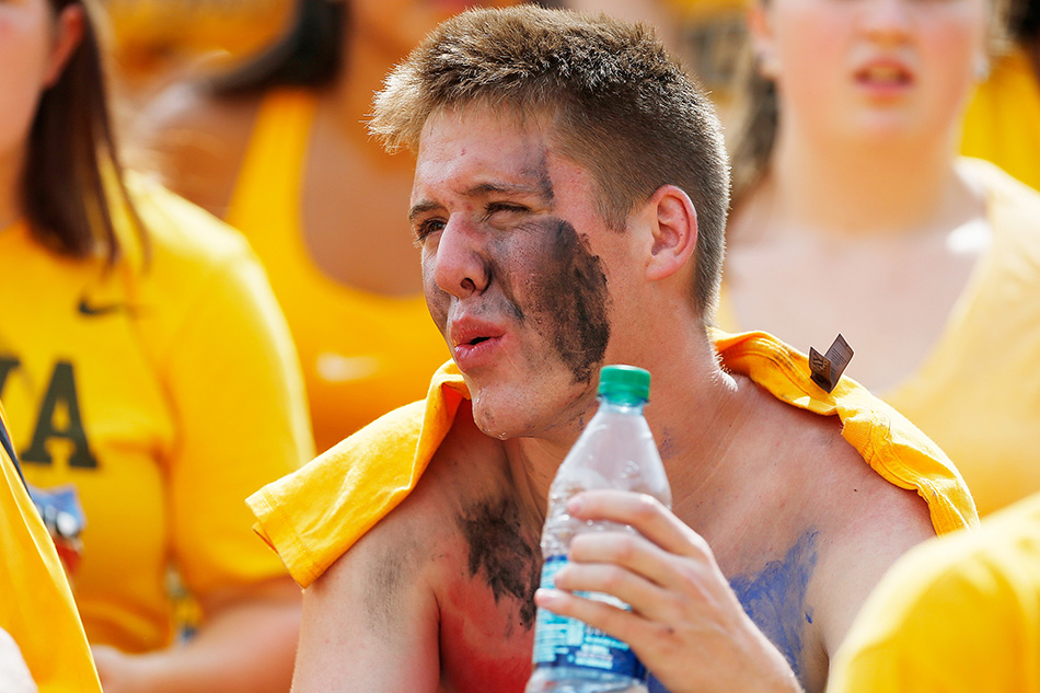An Iowa fan sweats in the 4th quarter of a NCAA college football game against the Illinois State Redbirds at Kinnick Stadium in Iowa City on Saturday, Sept. 5, 2015. (Adam Wesley/The Gazette)