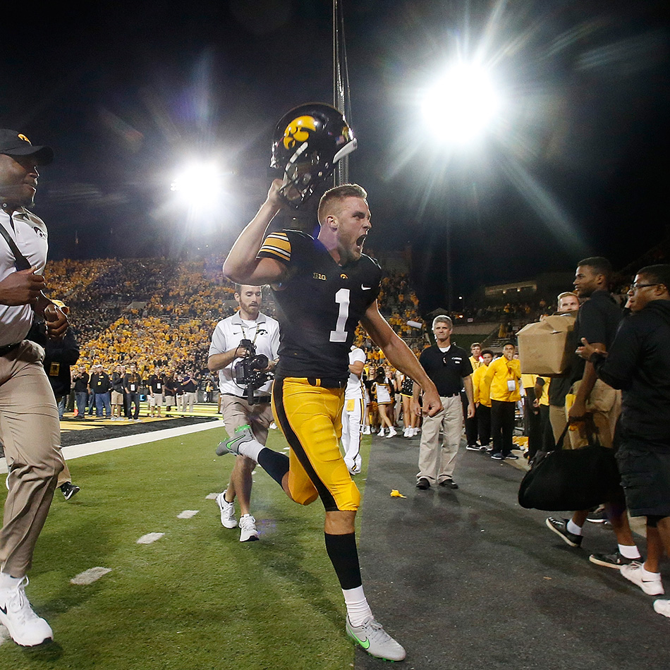 Iowa Hawkeyes place kicker Marshall Koehn (1) screams in celebration as he leaves the field after kicking a 57-yard game-winning field goal against the Pittsburgh Panthers in a NCAA football game at Kinnick Stadium in Iowa City on Saturday, Sept. 19, 2015. (Adam Wesley/The Gazette)