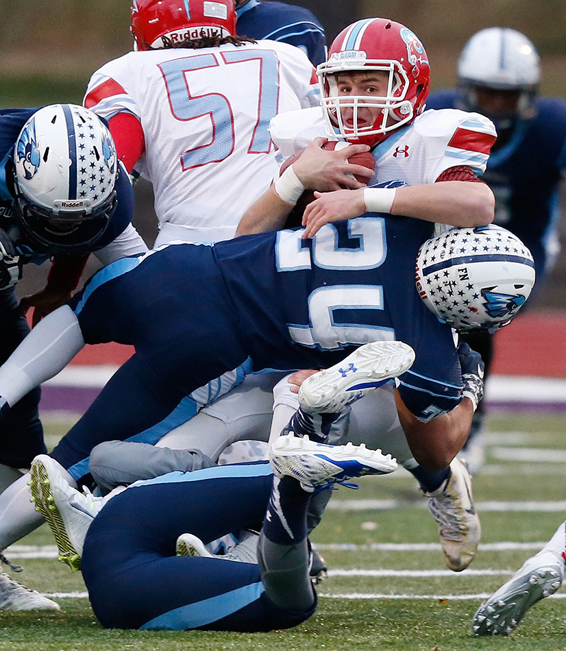 Cedar Rapids Jefferson's Tavian Rashed (24) tackles Dubuque Senior's Lee Bonifas (1) in a 1st round class 4A high school football playoff game at Ash Park Stadium at Cornell College in Mount Vernon on Wednesday, Oct. 28, 2015. (Adam Wesley/The Gazette)