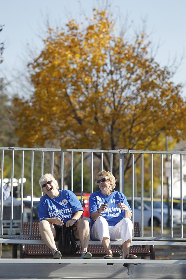 Sharon Anderson (left) and Leslie Carpenter both of Iowa City laugh together as they wait for Democratic Presidential candidate Hillary Clinton to arrive for a town hall event at S.T. Morrison Park in Coralville on Tuesday, Nov. 3, 2015. (Adam Wesley/The Gazette)