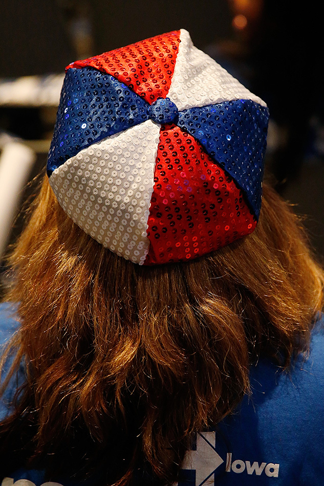 A supporter of Democratic Presidential candidate Hillary Clinton wears a patriotic hat at the Iowa Democratic Party's Jefferson-Jackson Dinner in Des Moines on Saturday, Oct. 24, 2015. (Adam Wesley/The Gazette)