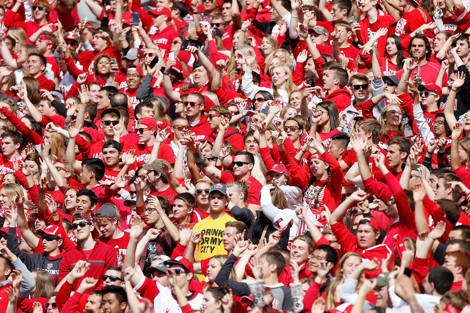A lone Iowa fans stands in the Wisconsin student section as the Wisconsin fans "jump around" in a NCAA football game at Camp Randall stadium in Madison on Saturday, Oct. 3, 2015. (Adam Wesley/The Gazette)