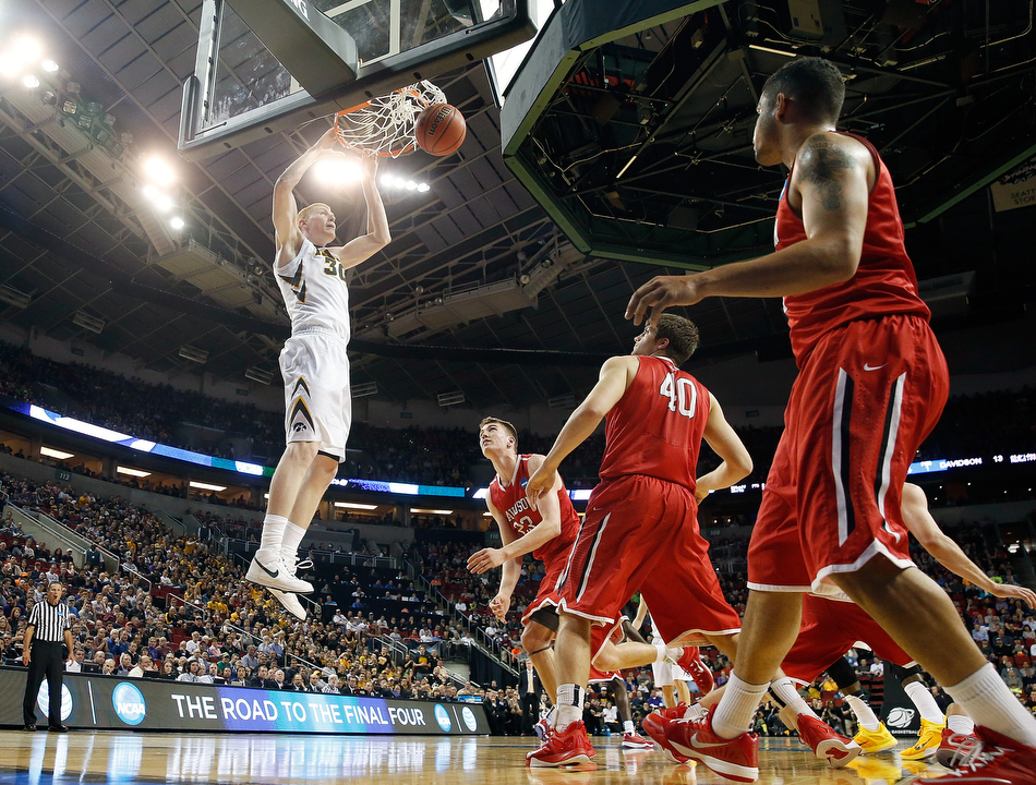 Iowa forward Aaron White (30) dunks against Davidson in a 2nd round men's basketball NCAA tournament game at KeyArena in Seattle on Friday, March 20, 2015. (Adam Wesley/The Gazette)