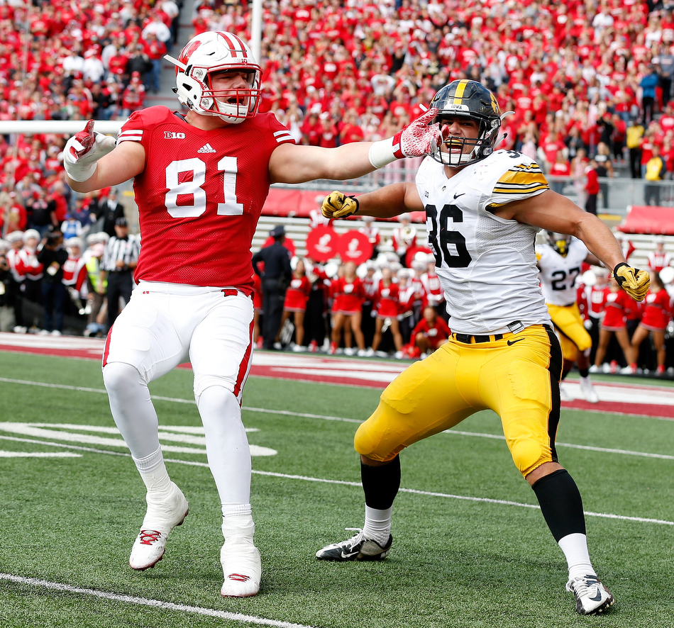 Wisconsin Badgers tight end Troy Fumagalli (81) and Iowa Hawkeyes linebacker Cole Fisher (36) react as a pass intended for Fumagalli falls incomplete on 4th down late in the 4th quarter in a NCAA football game at Camp Randall stadium in Madison on Saturday, Oct. 3, 2015. (Adam Wesley/The Gazette)